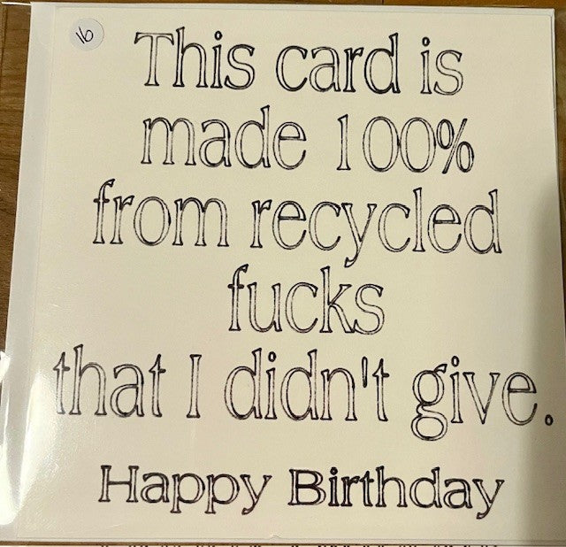 Card with humorous text about recycled materials on a plain background