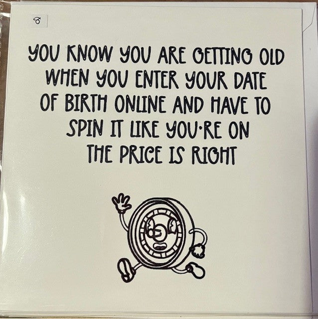 White card with black text and a cartoon clock on a white background, humorous message about age