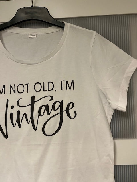White t-shirt with 'I'm not old, I'm vintage' text