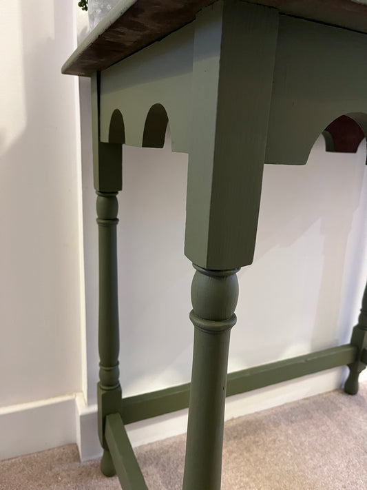 Close up of legs and underside of green table