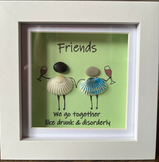 Framed artwork with seashells and text on a green background