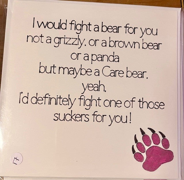 Card with humorous bear-themed text and a paw print on a white background