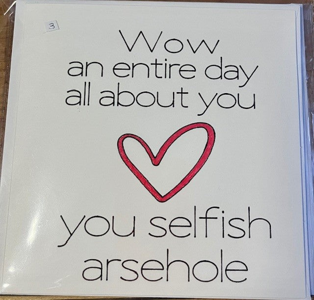 Card with a red heart and humorous text on a white background