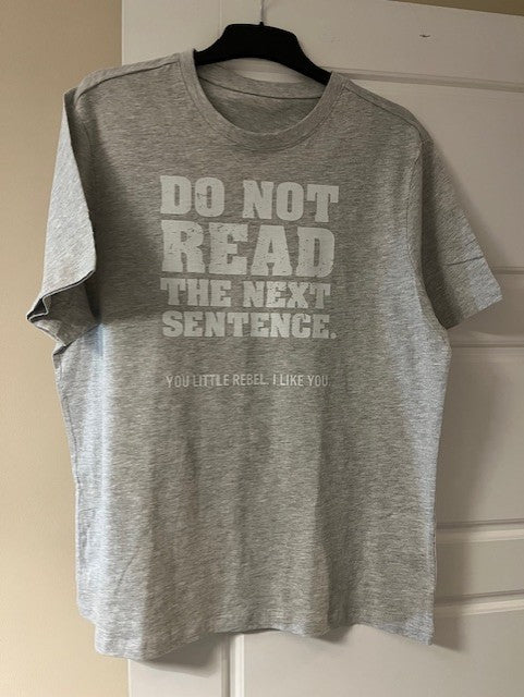 Grey t-shirt with white humorous text 