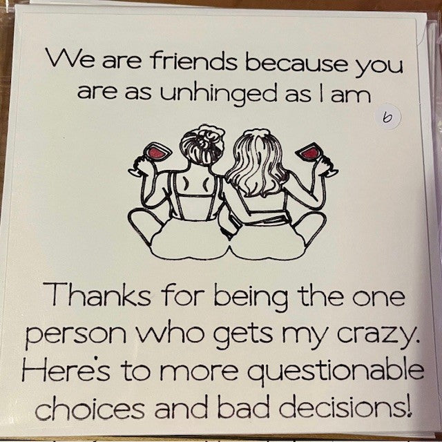 Card with two women sitting together, holding wine glasses, and text about friendship and shared crazy moments.