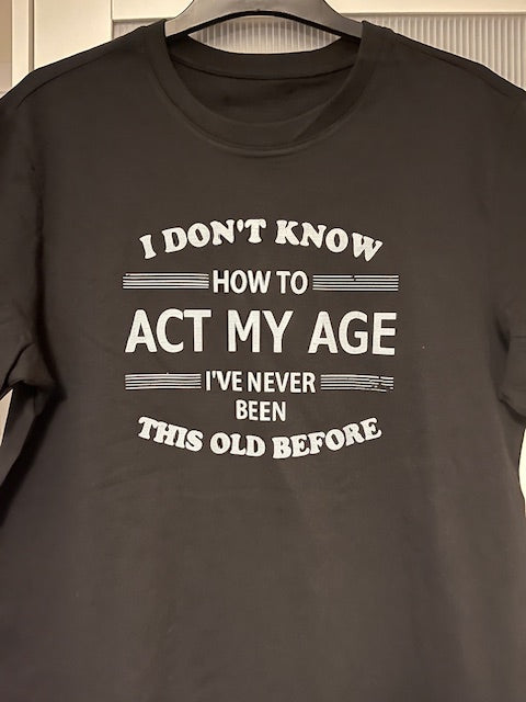 Black t-shirt with white text on a plain background