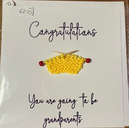 Greeting card with yellow knitted item and knitting needles on a white background, with text 'Congratulations You are going to be grandparents'.