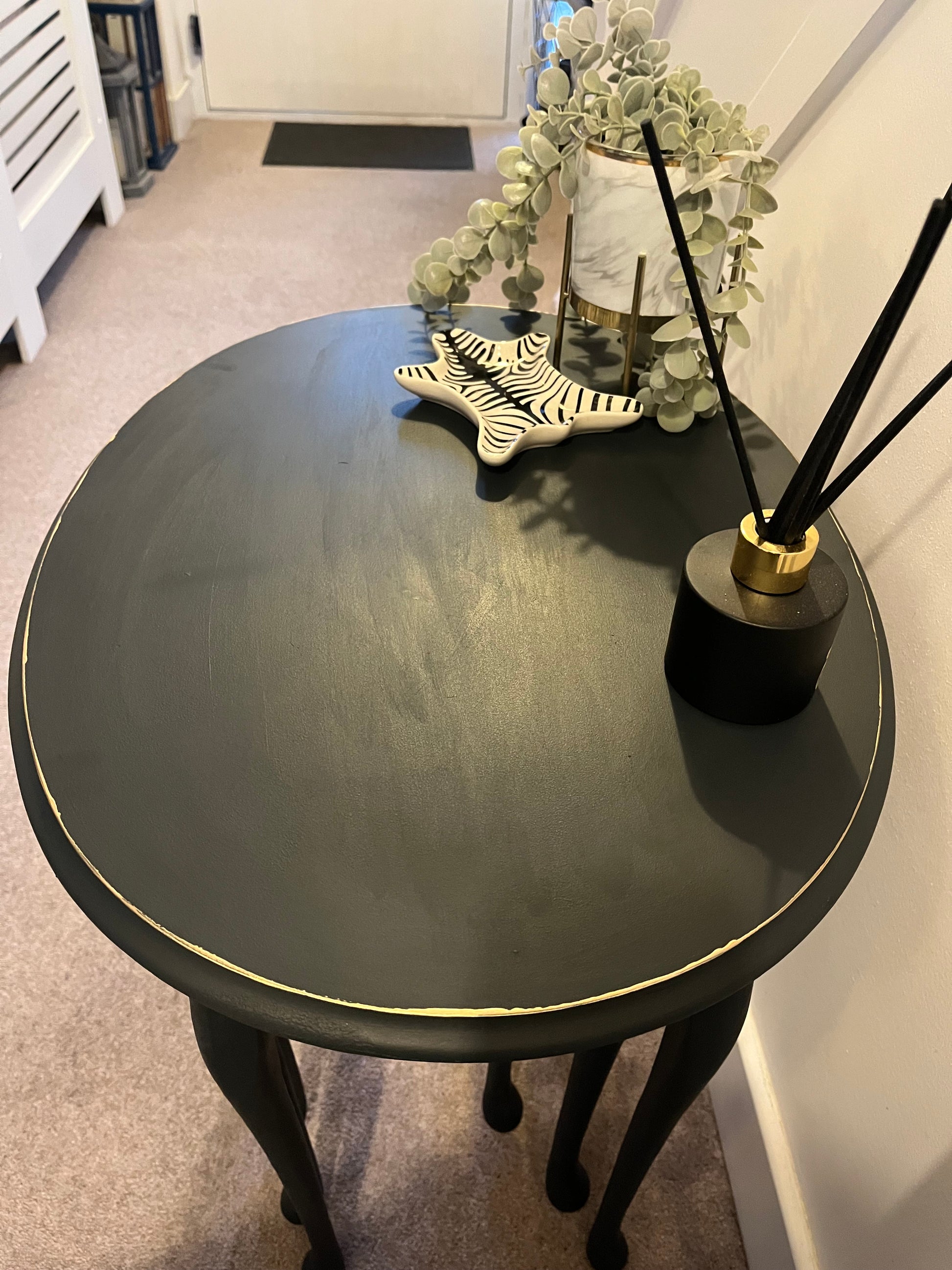 Black oval upper table 