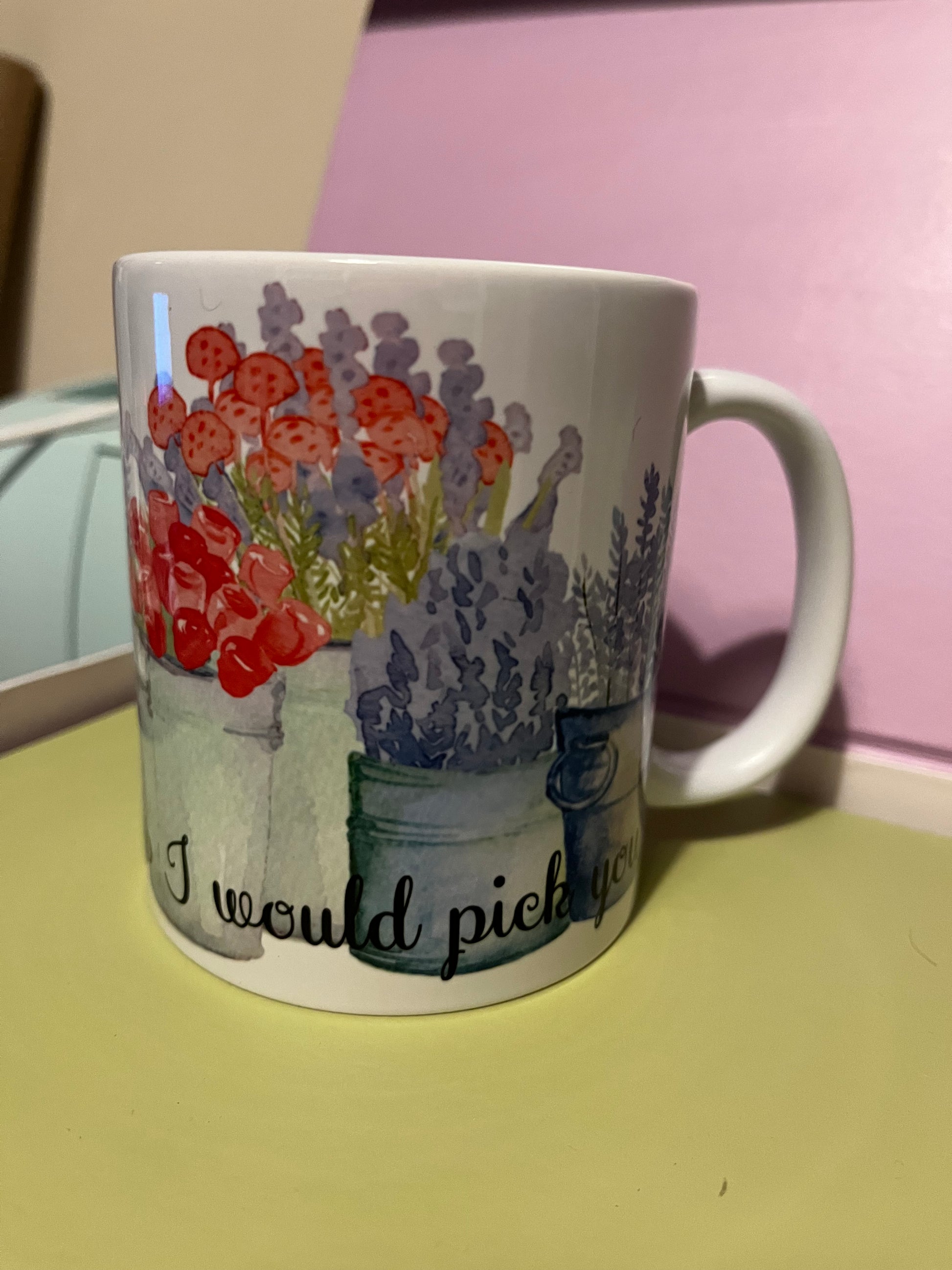 Mug with a colorful design and text 
