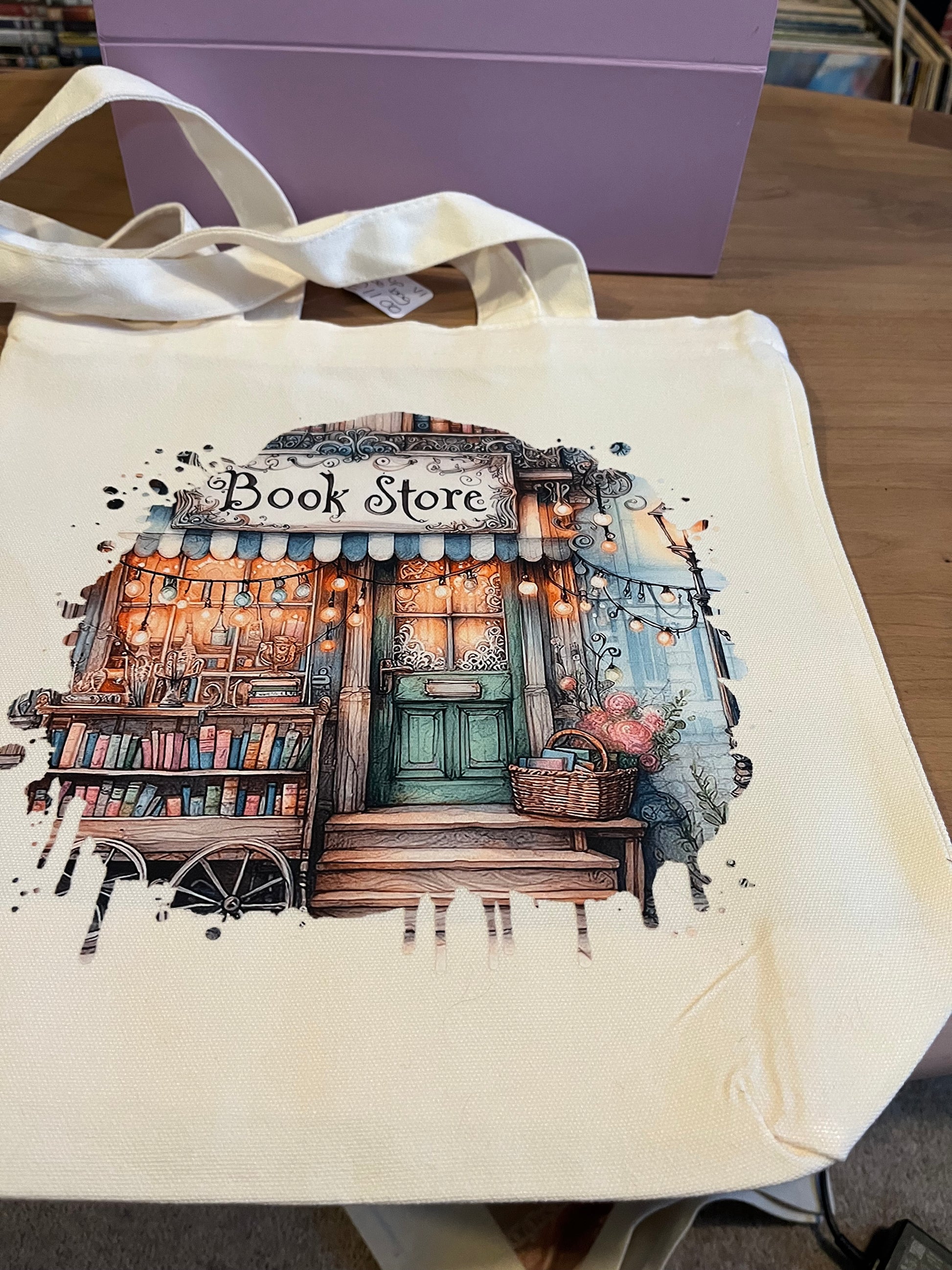 Tote bag with a design of a book store on a neutral background. Book store option