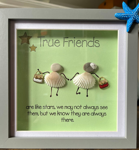 Framed artwork with seashells and text on a green background