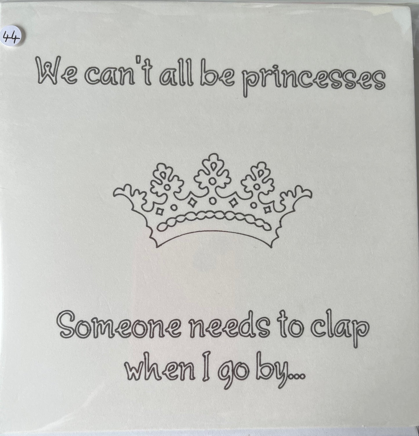 Card with text 'We can't all be princesses' and 'Someone needs to clap when I go by...' on a white background.