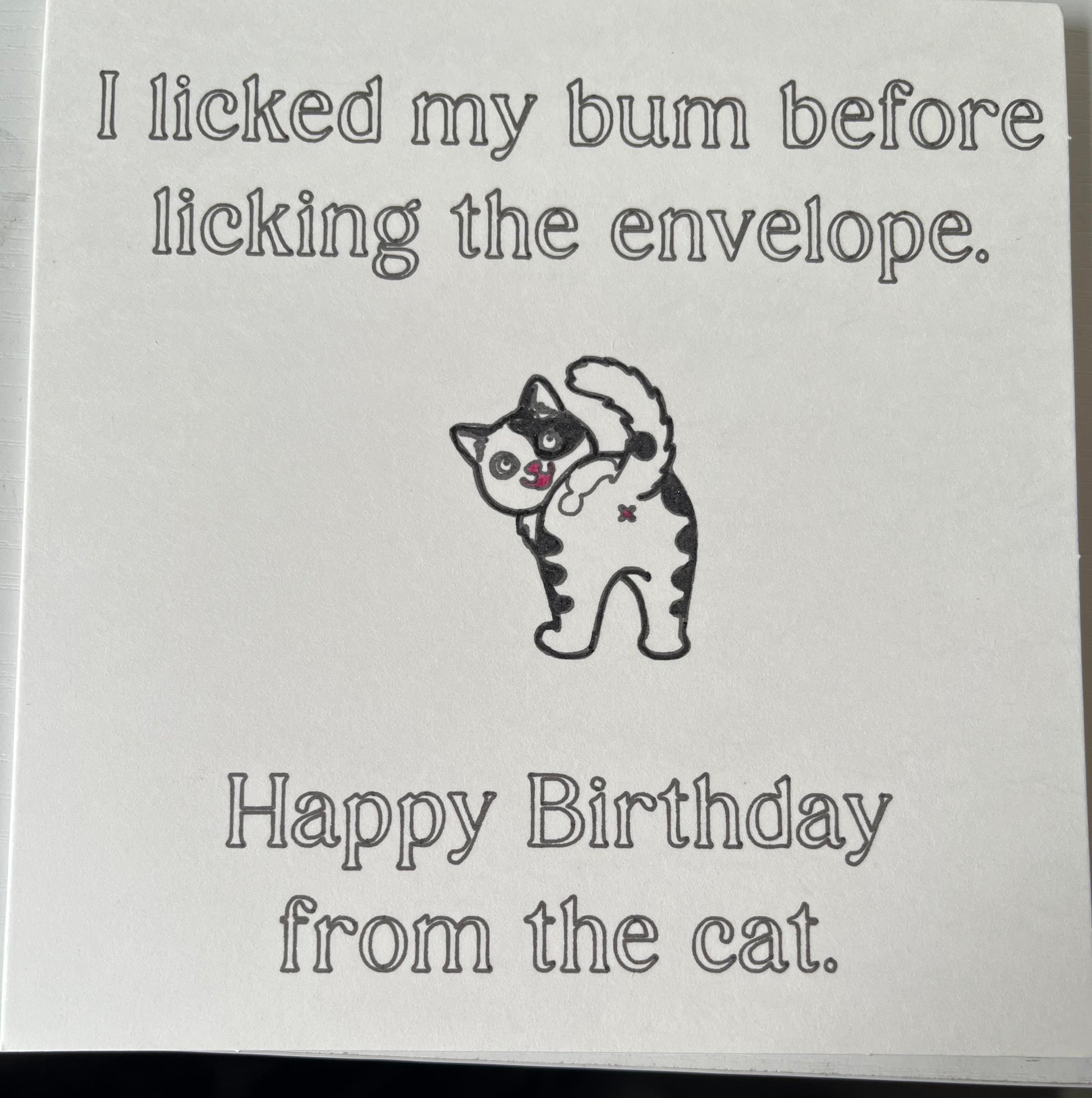 Card with a cat illustration and humorous text on a white background