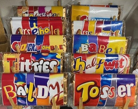 Assorted Galaxy bars displayed on a rack with colorful wrappers.