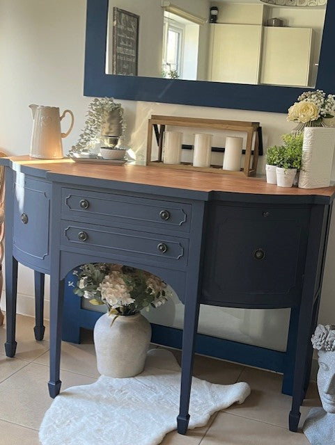 Blue sideboard with wooden top in a room setting