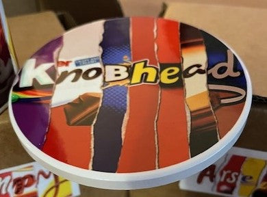 Colorful coaster with 'Knobhead' wording