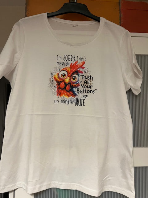 White t-shirt with a colorful rooster graphic and black text