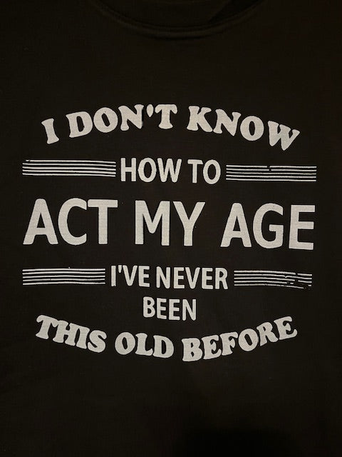 Black t-shirt with white text on a black background