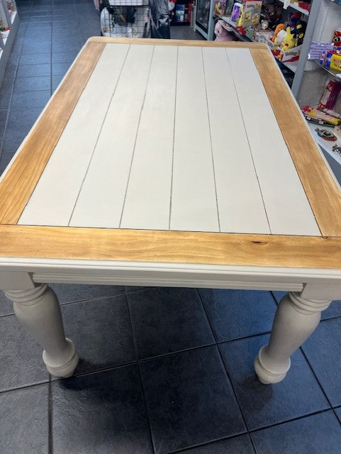 large wooden table with cream painted centre and cream solid legs
