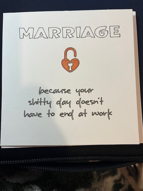 Greetings card with humorous text about marriage and a lock illustration on a white background