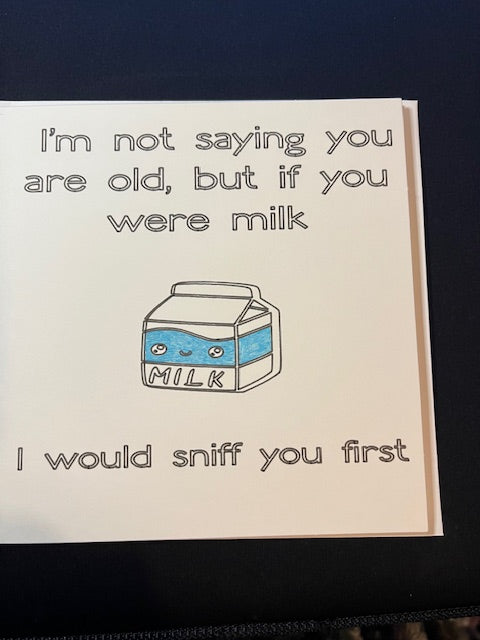 Greetings card with a milk carton illustration and humorous text on a white background